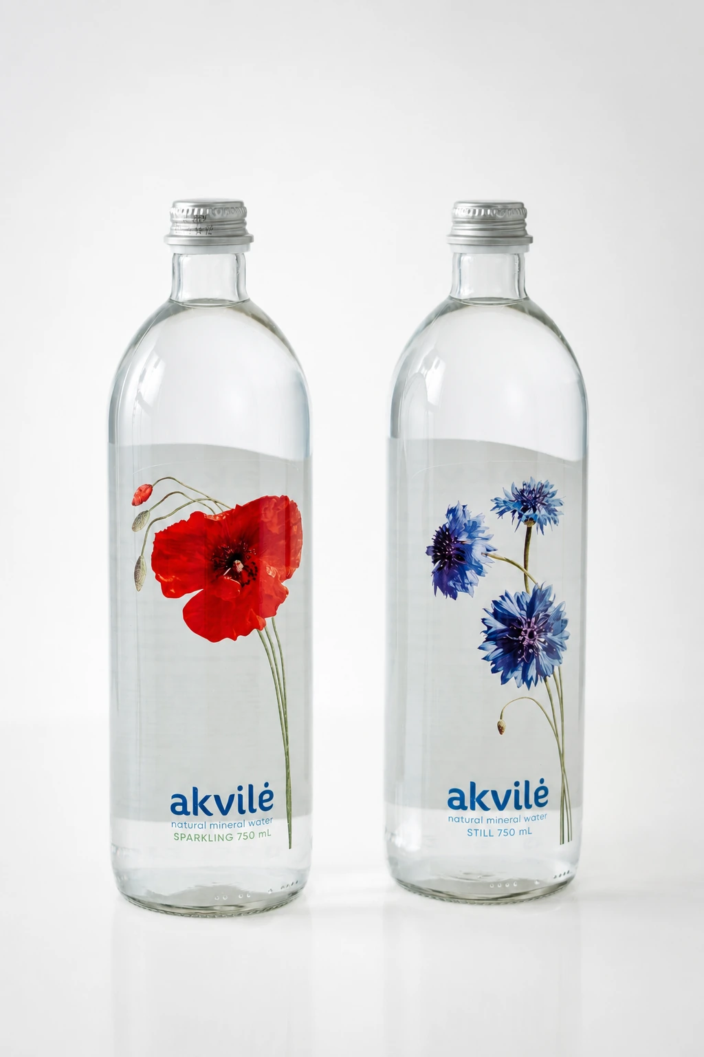 akvilė sparkling and still 750 mL bottles side by side, poppy and cornflower
