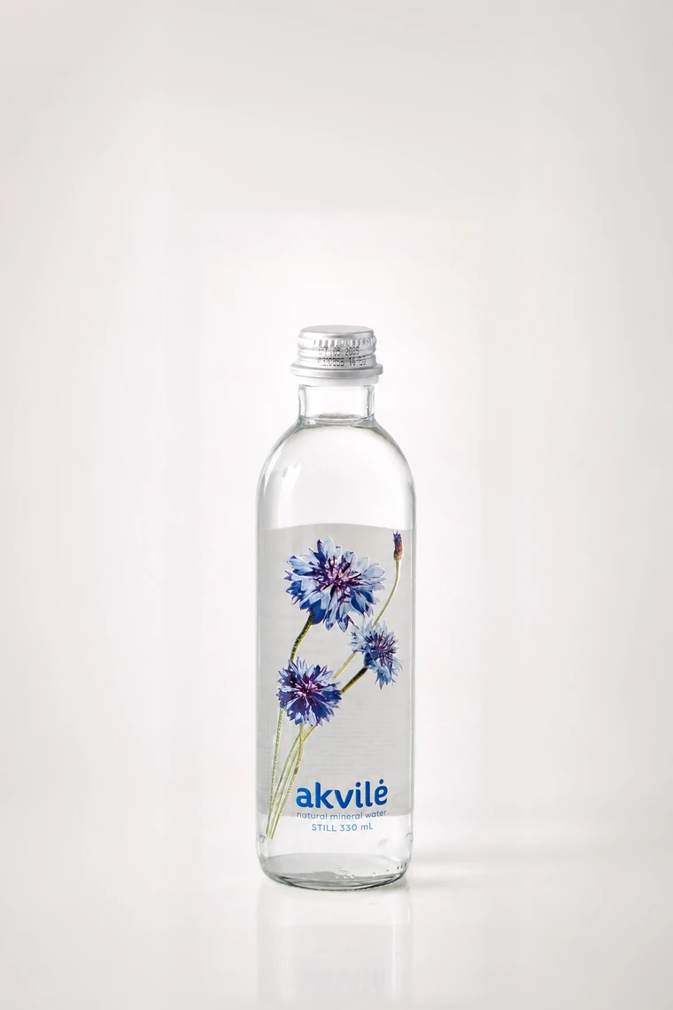 akvilė still natural mineral water 330 mL glass bottle with blue cornflower artwork